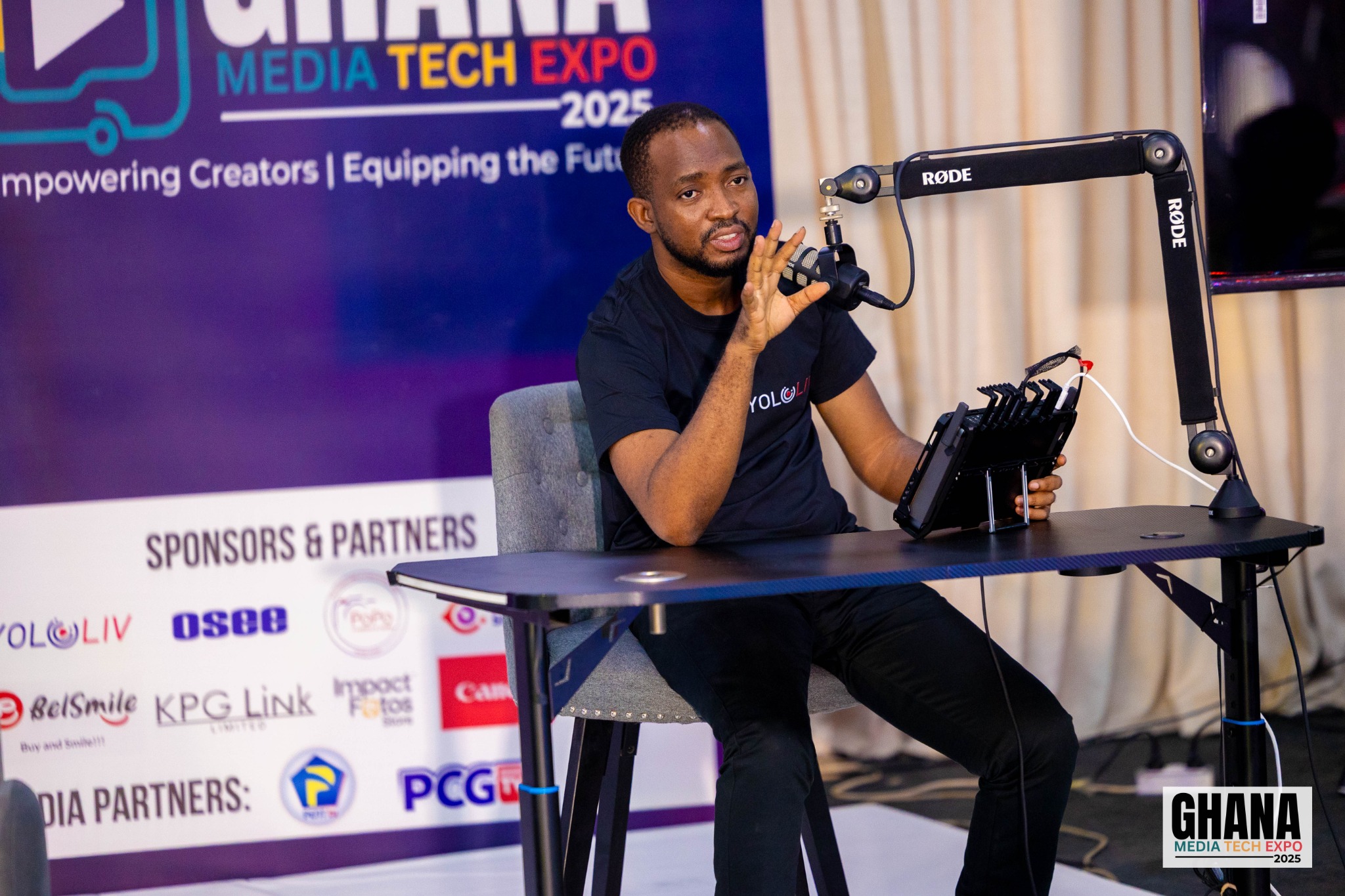 Azasoo Andrew demonstrating a podcast production setup at Ghana Media Tech Expo 2025